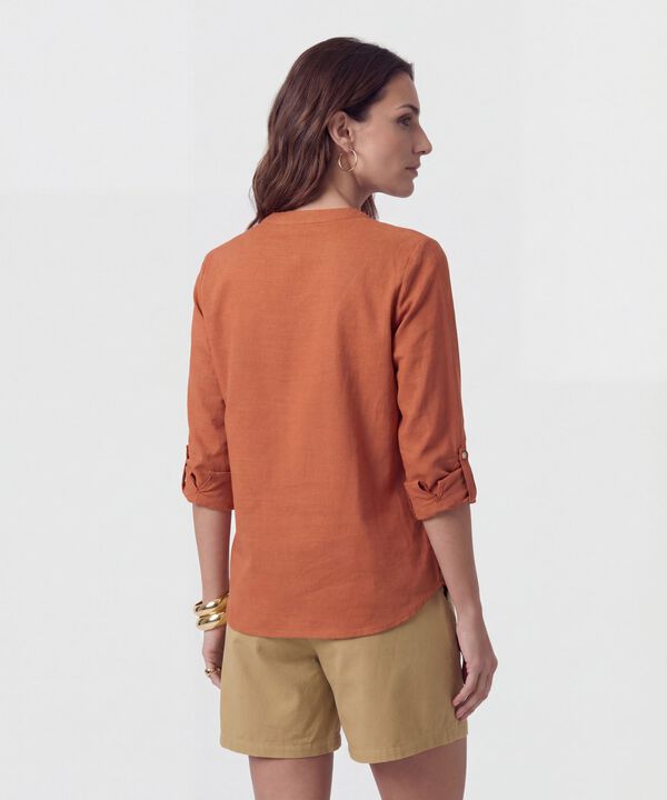 Blusa Fluida Con Bolsillos Frontales